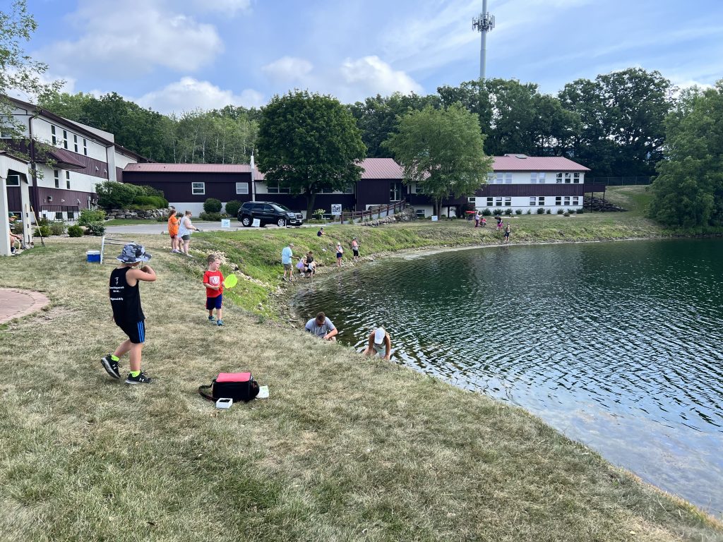 Children fishing in the lake at Cleary Building Corp. headquarters. 