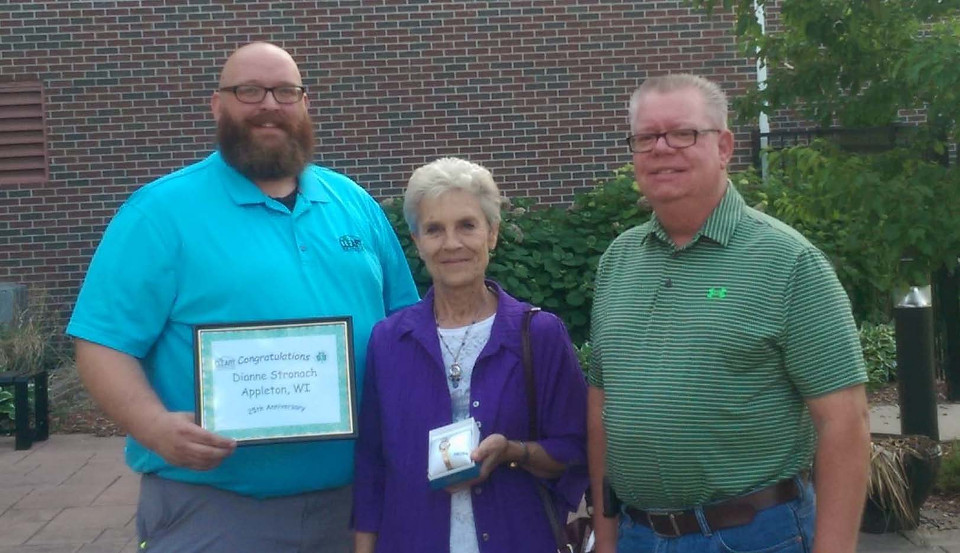 CLEARY BUILDING CORP. EMPLOYEE RECOGNIZED FOR LONG-TERM DEDICATED SERVICE. Three people pictured: Dianne Stronach (middle) was recently recognized for more than 25 years of service with Cleary Building Corp., Scott Goodell (left) and Tim Johnson.