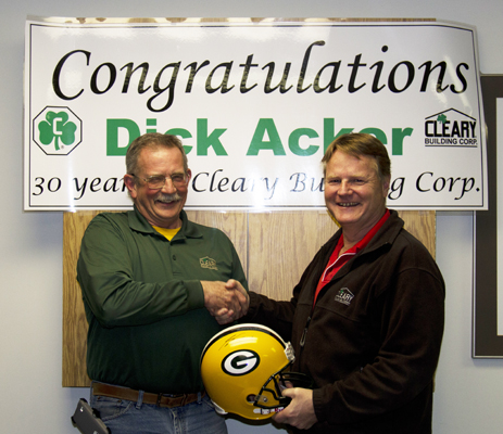 Dick shakes hands with Todd as he is presented with signed Packer helmet.