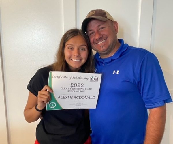 Alexi and her dad, Jeff. Alexi holds the 2022 Cleary Building Corp. scholarship award.