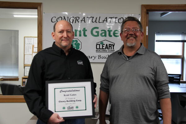Karl, Vice President of Engineering, presents Kent with anniversary certificate and Cleary decanter.